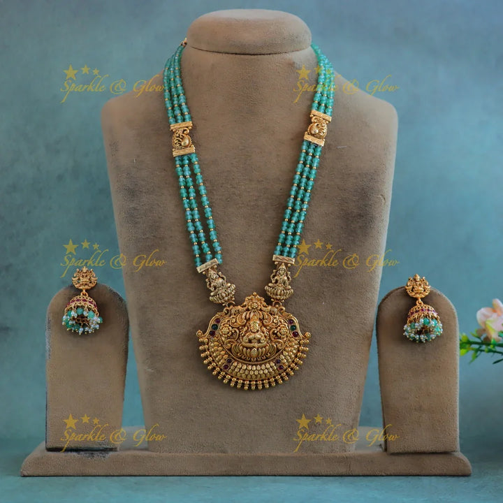Grand Idol Lakshmi Peacock pendant Haram with three layered mintgreen beads - Sparkle and Glow