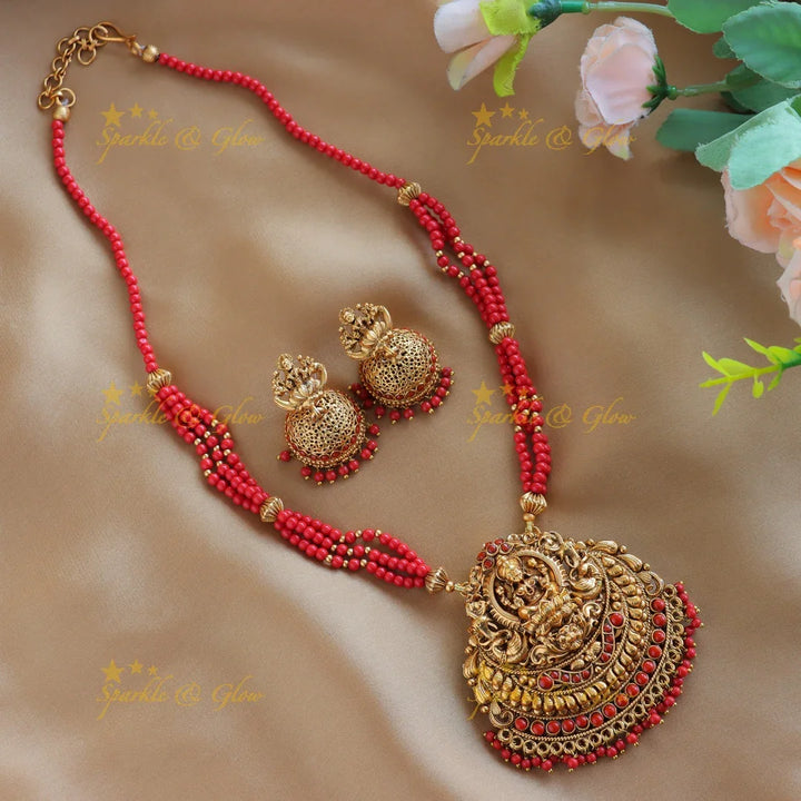 Sparkling Idol Lakshmi Peacock pendant carved Coral beaded Haram - Sparkle and Glow