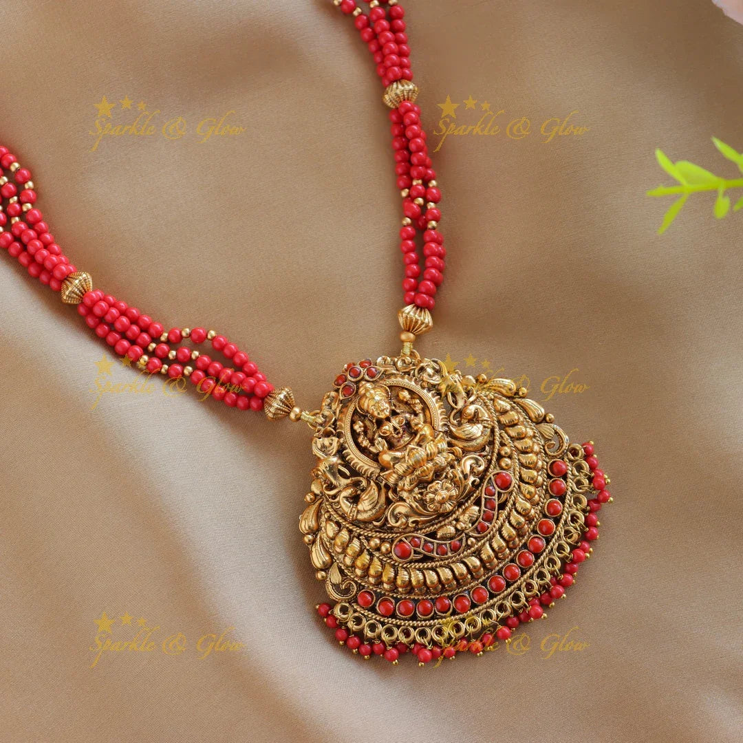 Sparkling Idol Lakshmi Peacock pendant carved Coral beaded Haram - Sparkle and Glow