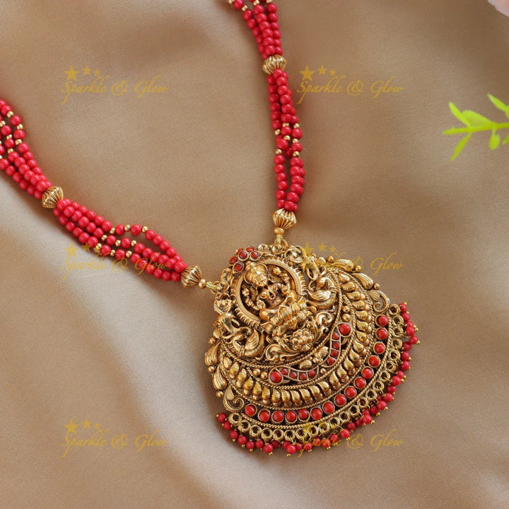 Sparkling Idol Lakshmi Peacock pendant carved Coral beaded Haram - Sparkle and Glow