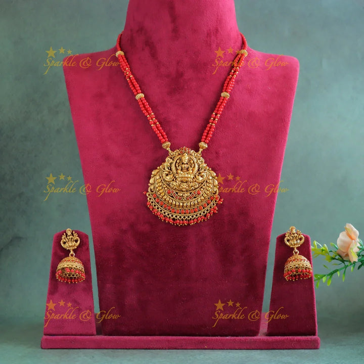 Sparkling Idol Lakshmi Peacock pendant carved Coral beaded Haram - Sparkle and Glow