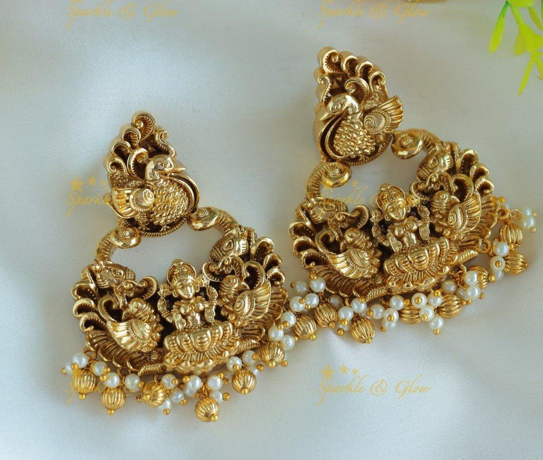 Beautiful Idol Lakshmi Peacock carved chandbali with pearls and gold beads - Sparkle and Glow