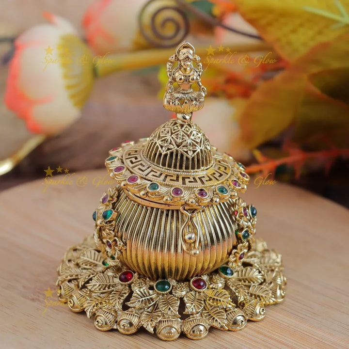 Sparkling Idol Lakshmi Swastik Leaf design Kumkum Box - Sparkle and Glow