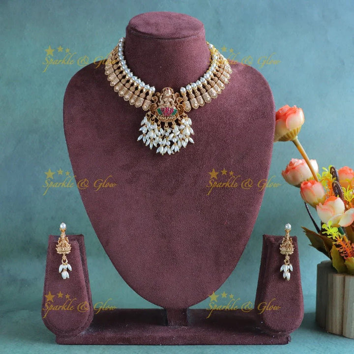 Sparkling Idol Lakshmi goemetric carved short necklace with rice pearls - Sparkle and Glow