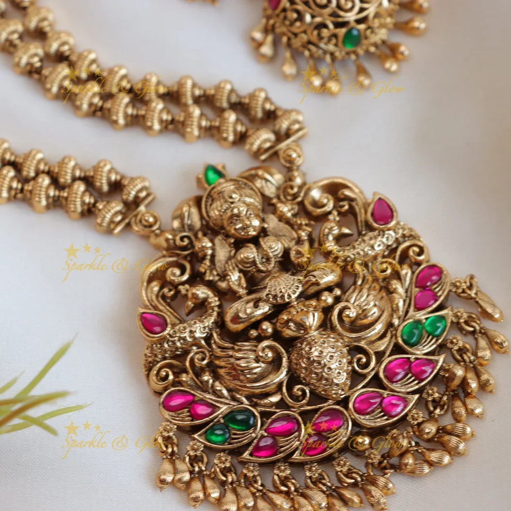 Elegant lakshmi and peacock design with gold beads long haram - pink,green - Sparkle and Glow