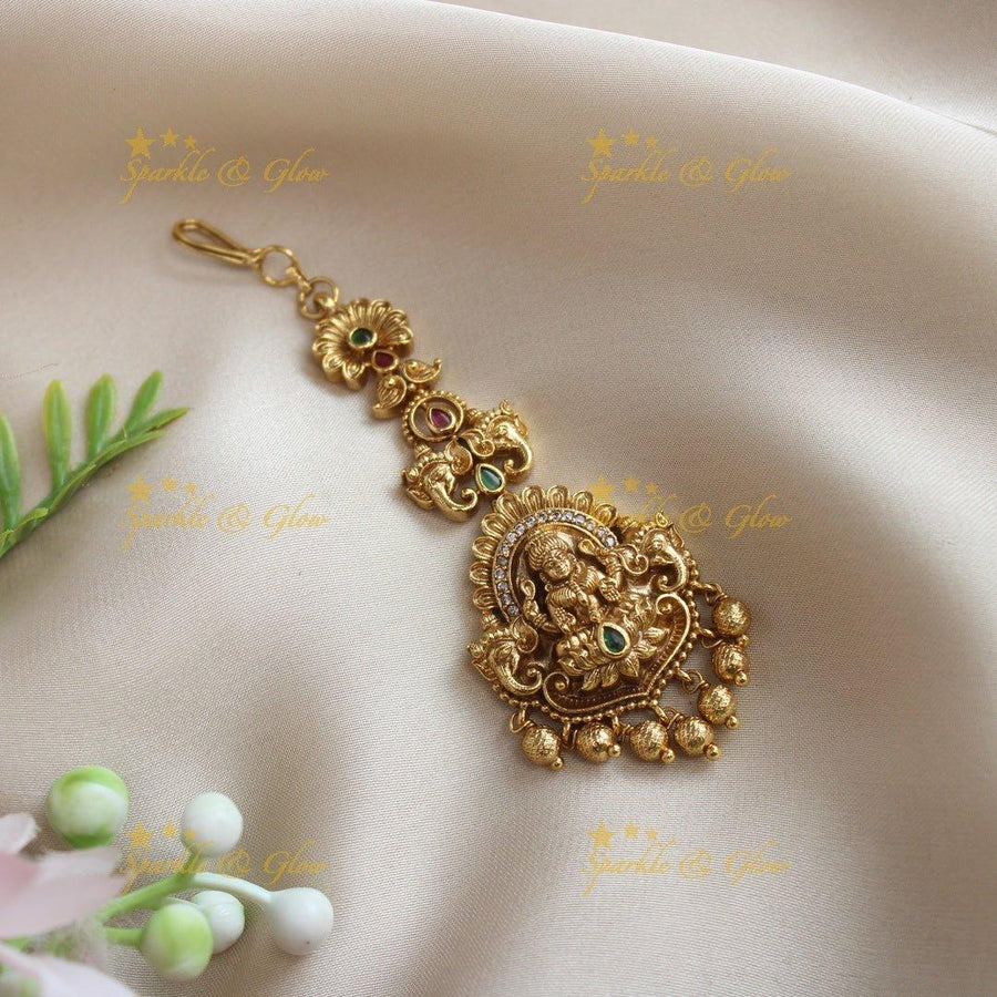 Statement Idol Lakshmi Elephant carved single line maangtikka - Sparkle and Glow