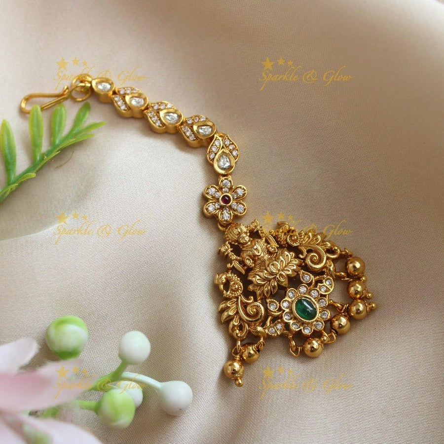 Idol Lakshmi Dancing peacock carved Maangtikka with AD stones - Sparkle and Glow