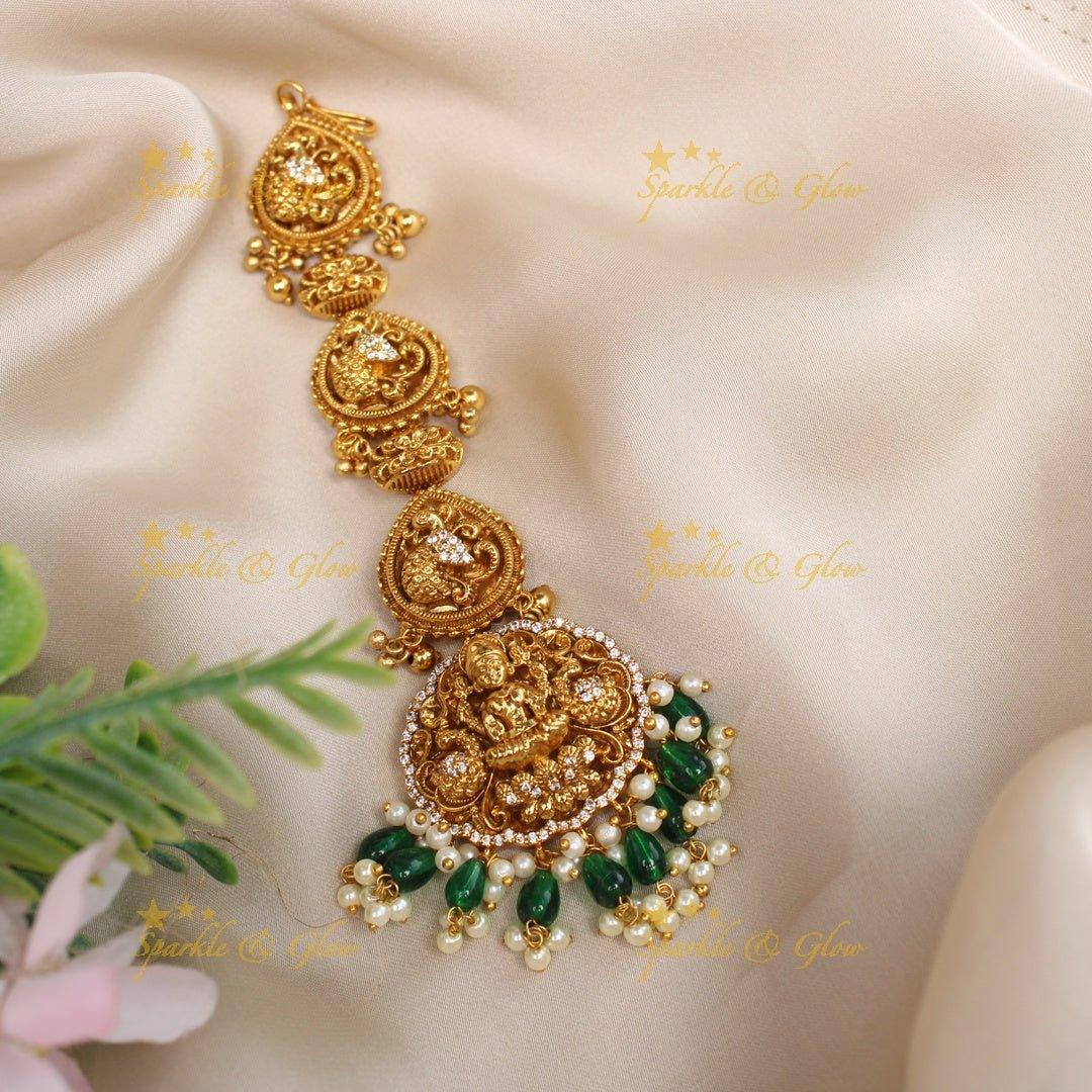 Grand Idol Lakshmi Peacock Maangtikka with green beads - Sparkle and Glow