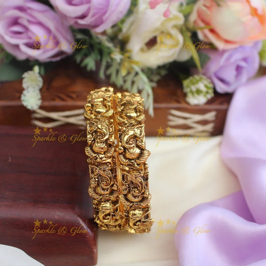 Gorgeous lord ganesha design gold alike bangles - Sparkle and Glow