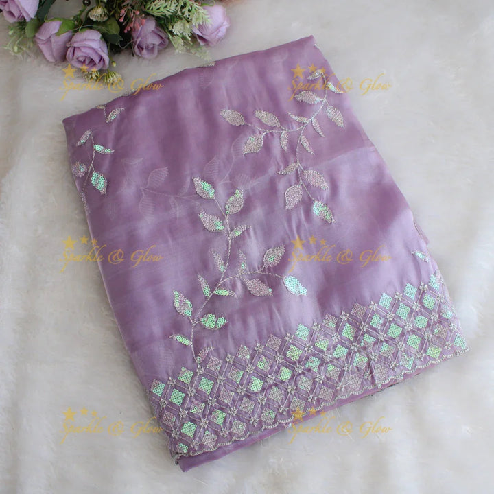 Beautiful leaf design lavender colour organza saree with dark purple blouse piece - Sparkle and Glow