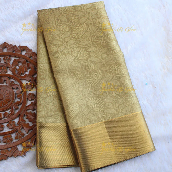 Nita Ambani Simple and elegant leaf and floral design gold colour banarasi tissue silk saree with blouse piece - Sparkle and Glow