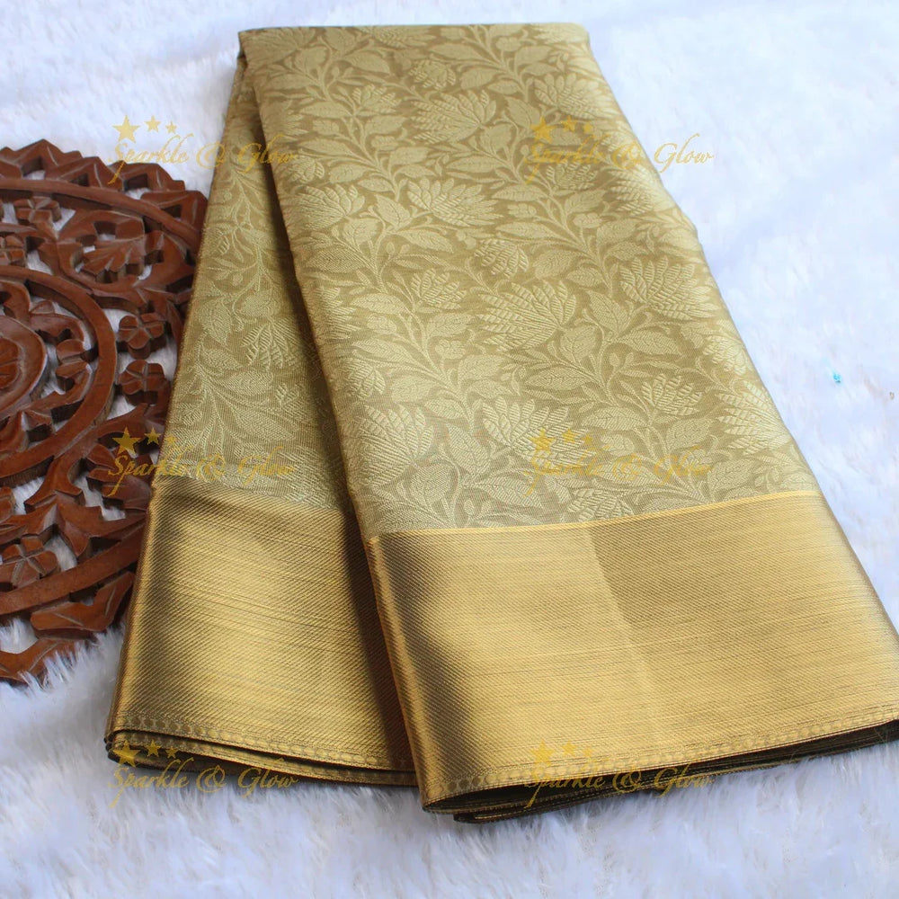 Nita Ambani Simple and elegant leaf and floral design gold colour banarasi tissue silk saree with blouse piece - Sparkle and Glow
