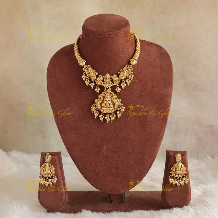 Elegant Idol Lakshmi Peacock carved Hasli short necklace with gold beads - Sparkle and Glow