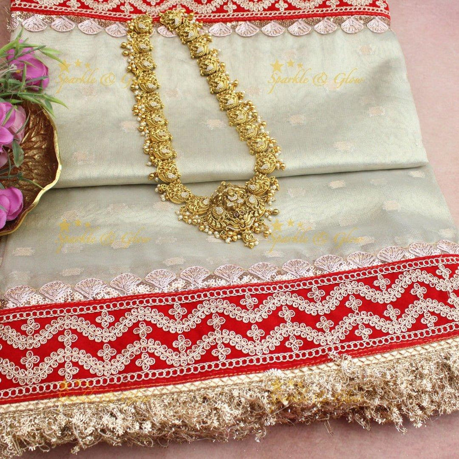 Mint Green Banarasi Soft Silk Saree with Embroidered Red Velvet Border & Golden Tassels - Sparkle and Glow