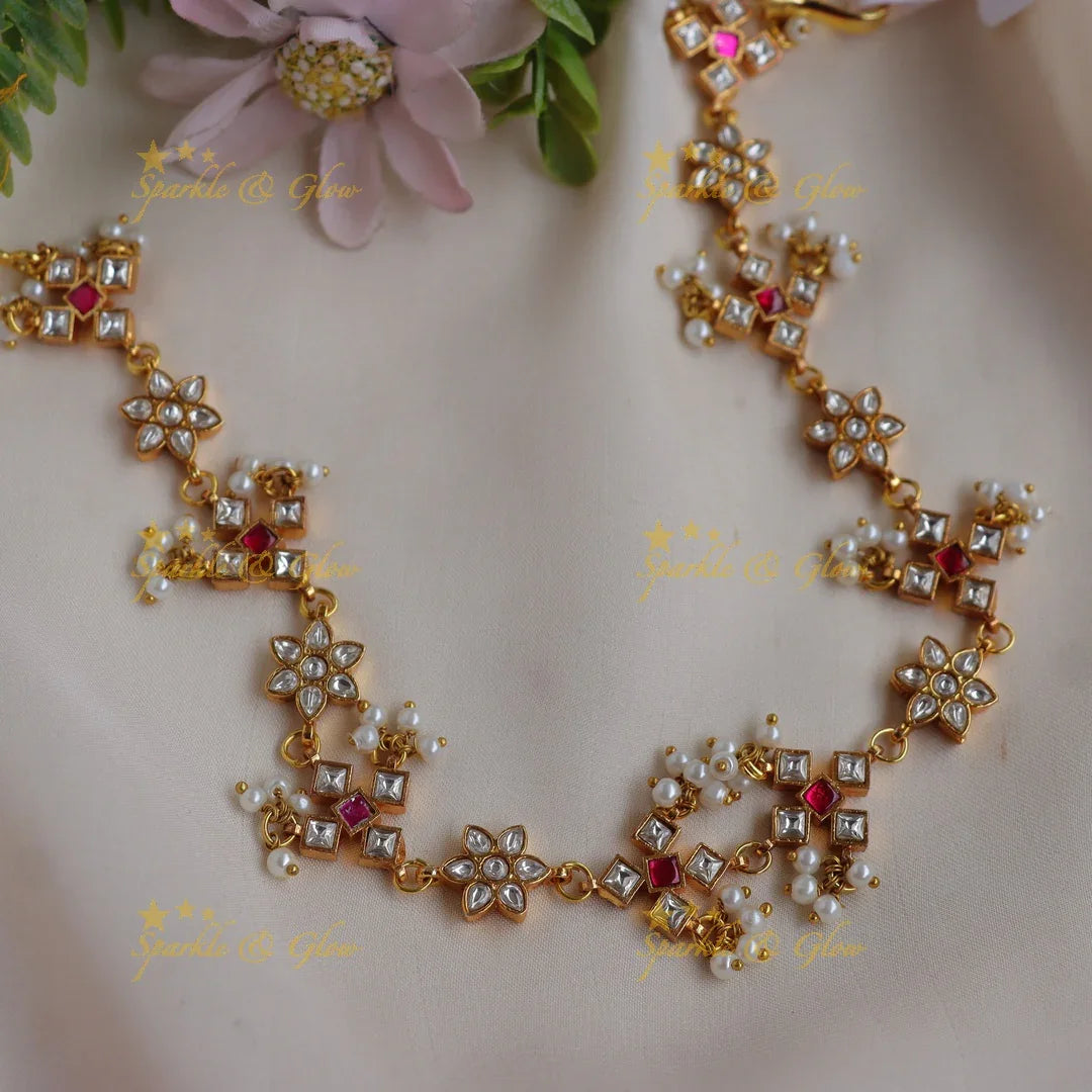 Elegant Jadau Floral Kundan Sheeshphool with Red Accents & Pearl Clusters - Sparkle and Glow
