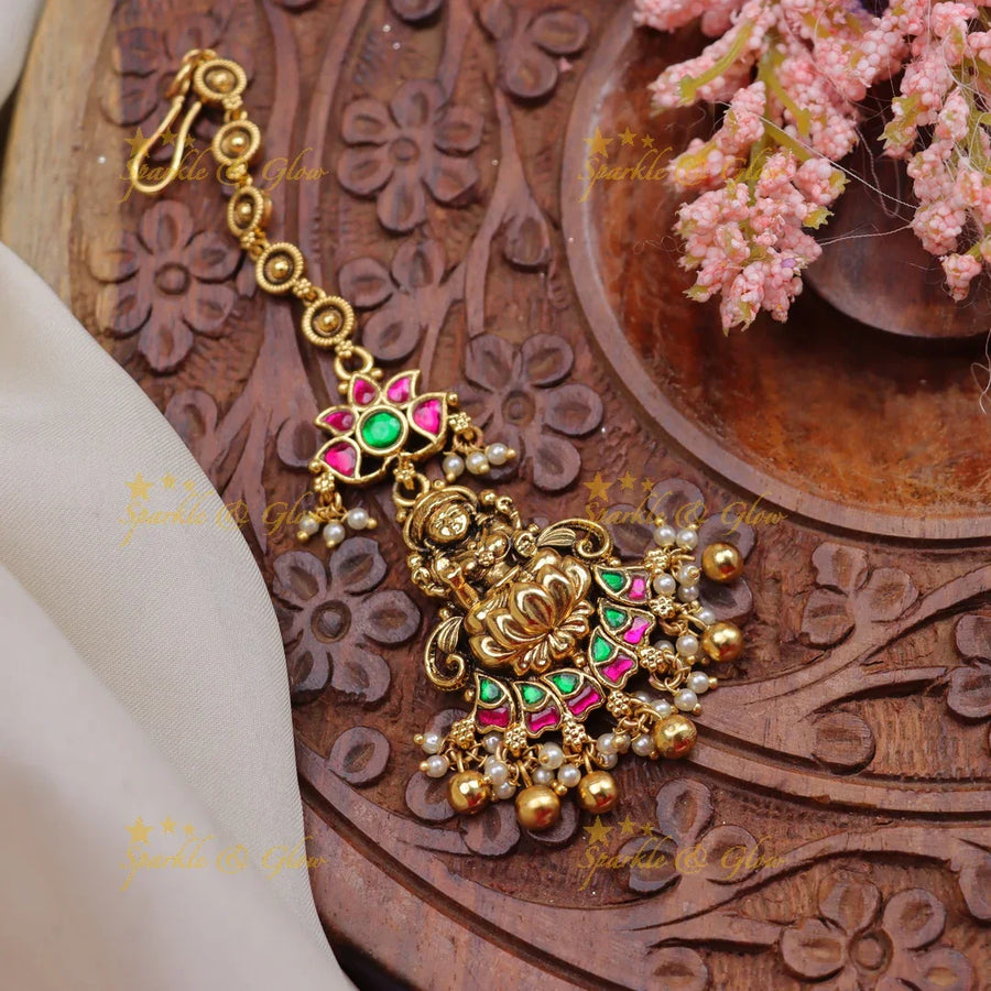 Stunning Jadau Kundan Temple Maang Tikka with Lakshmi Pendant & Enamel Lotus Design - Sparkle and Glow