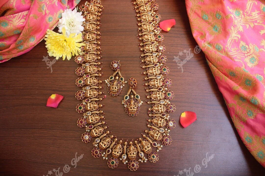 Gold alike polished lakshmi long necklace with flower studs made in real kemp stones - Sparkle and Glow