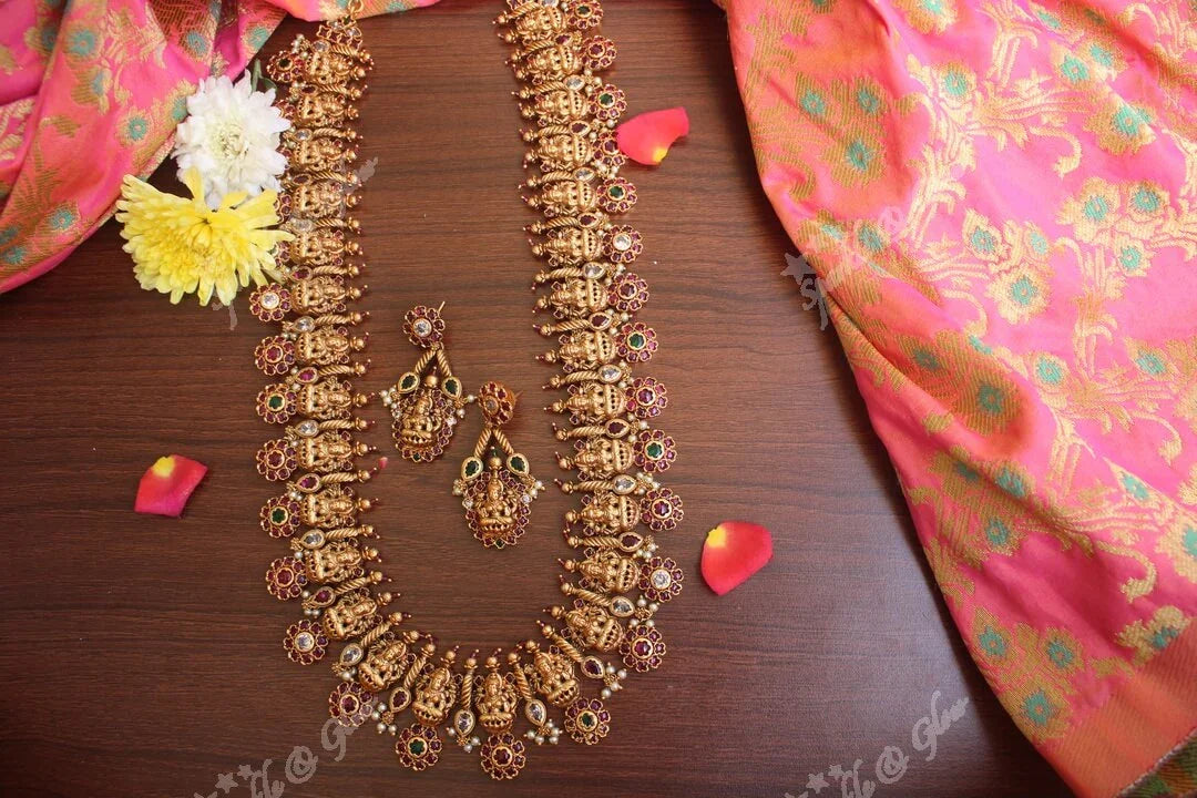 Gold alike polished lakshmi long necklace with flower studs made in real kemp stones - Sparkle and Glow