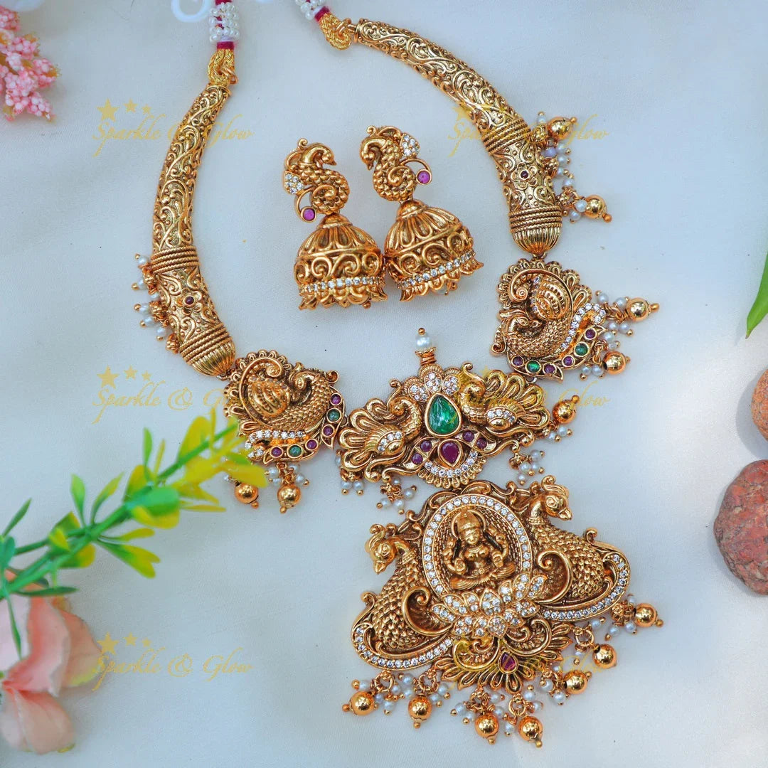 Beautiful Antique Gold alike Temple Hasli Kanti Necklace Set with Lakshmi Pendant & Peacock Motifs - Sparkle and Glow
