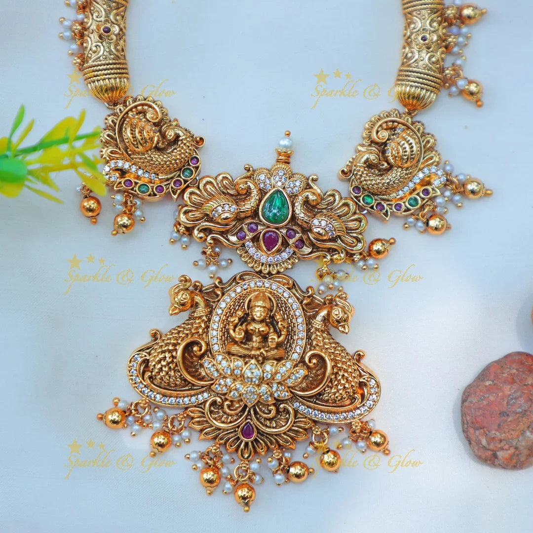 Beautiful Antique Gold alike Temple Hasli Kanti Necklace Set with Lakshmi Pendant & Peacock Motifs - Sparkle and Glow