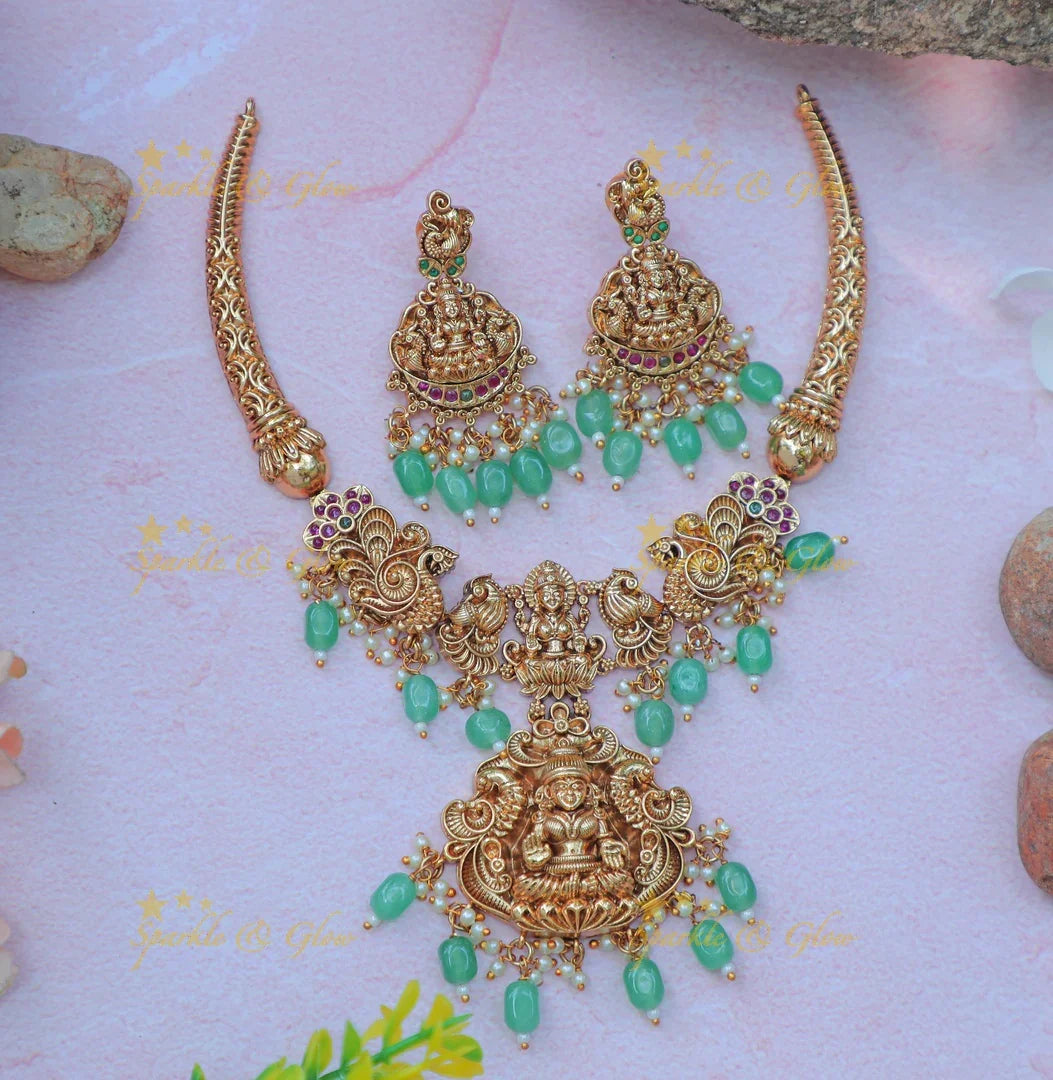 Elegant Idol Lakshmi Peacock carved Hasli short necklace with gold beads - Sparkle and Glow