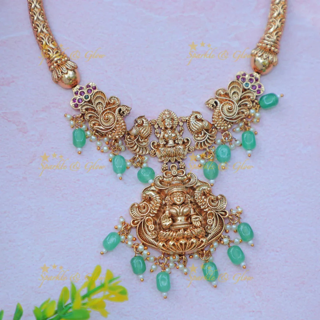 Elegant Idol Lakshmi Peacock carved Hasli short necklace with gold beads - Sparkle and Glow