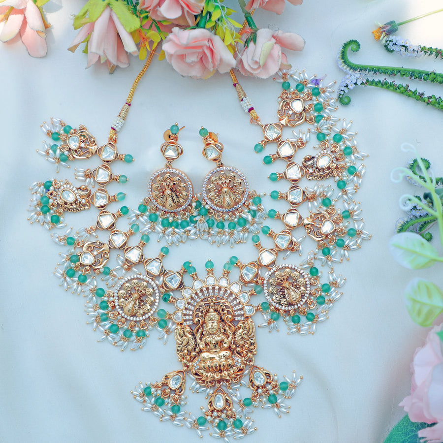Stunning Jadau Kundan Idol Lakshmi Peacock carved short necklace with Emerald stones and rice pearls - Sparkle and Glow
