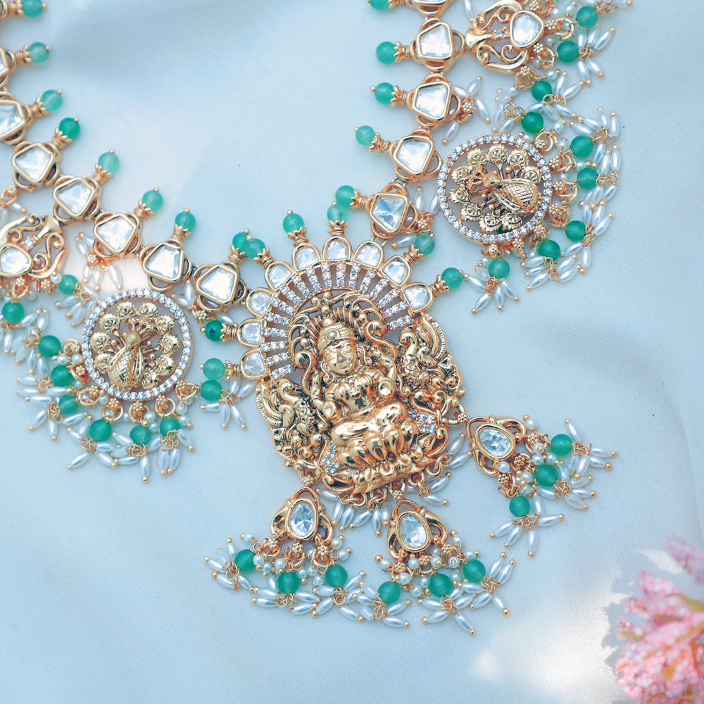 Stunning Jadau Kundan Idol Lakshmi Peacock carved short necklace with Emerald stones and rice pearls - Sparkle and Glow