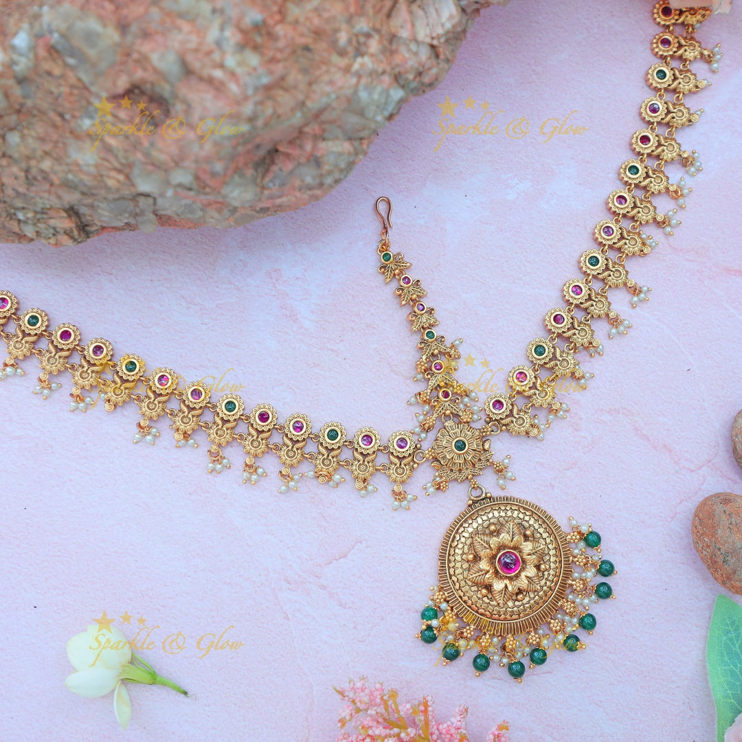 Elegant Antique Floral Maang Tikka with Green Beads and Kundan Accents