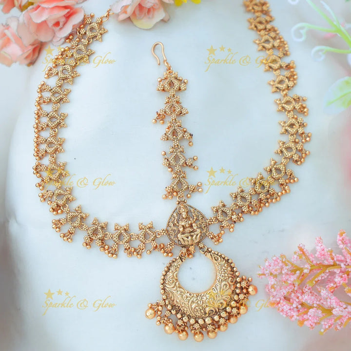 Antique Gold alike Idol Lakshmi leaf design Maang Tikka with Crescent Pendant - Sparkle and Glow