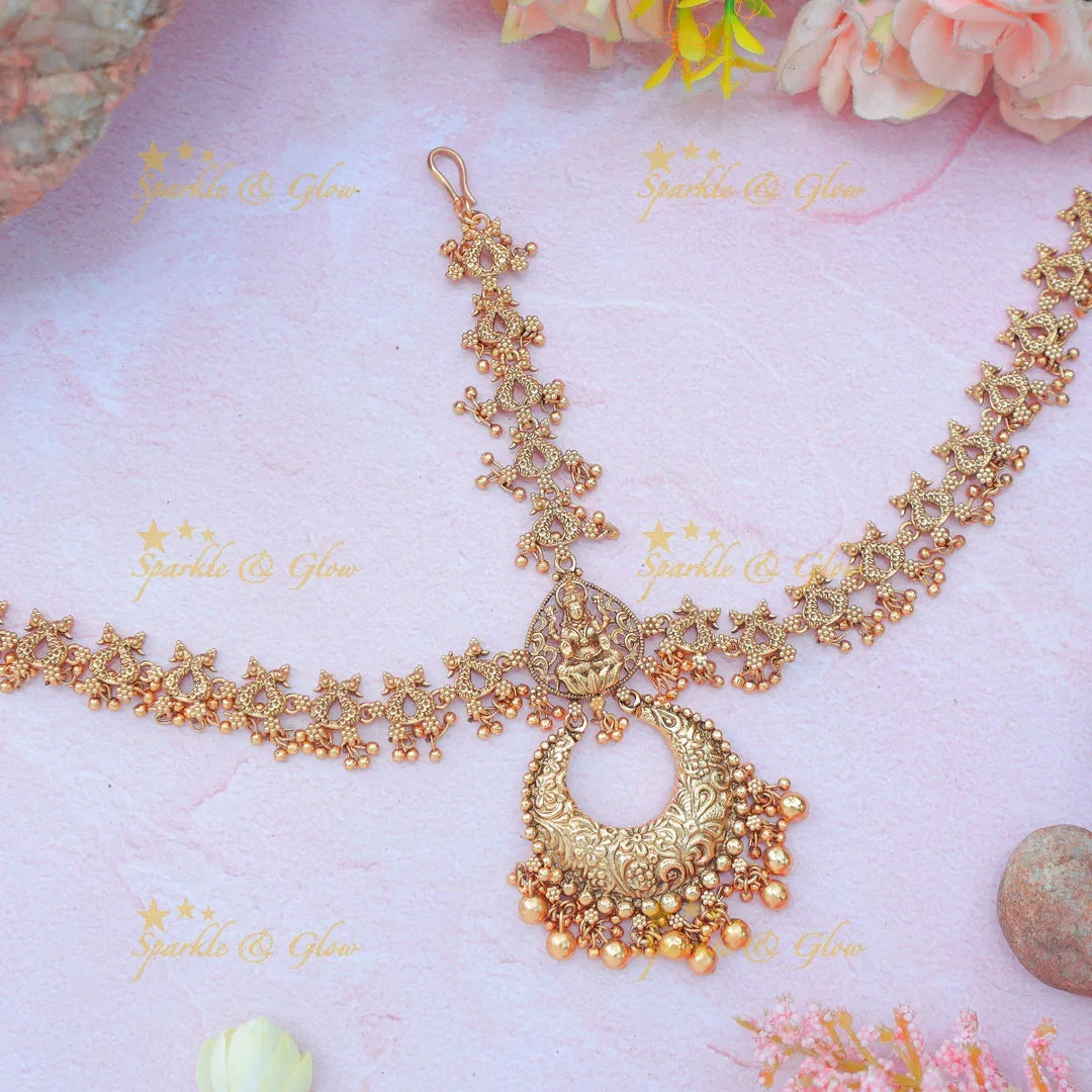 Antique Gold alike Idol Lakshmi leaf design Maang Tikka with Crescent Pendant - Sparkle and Glow