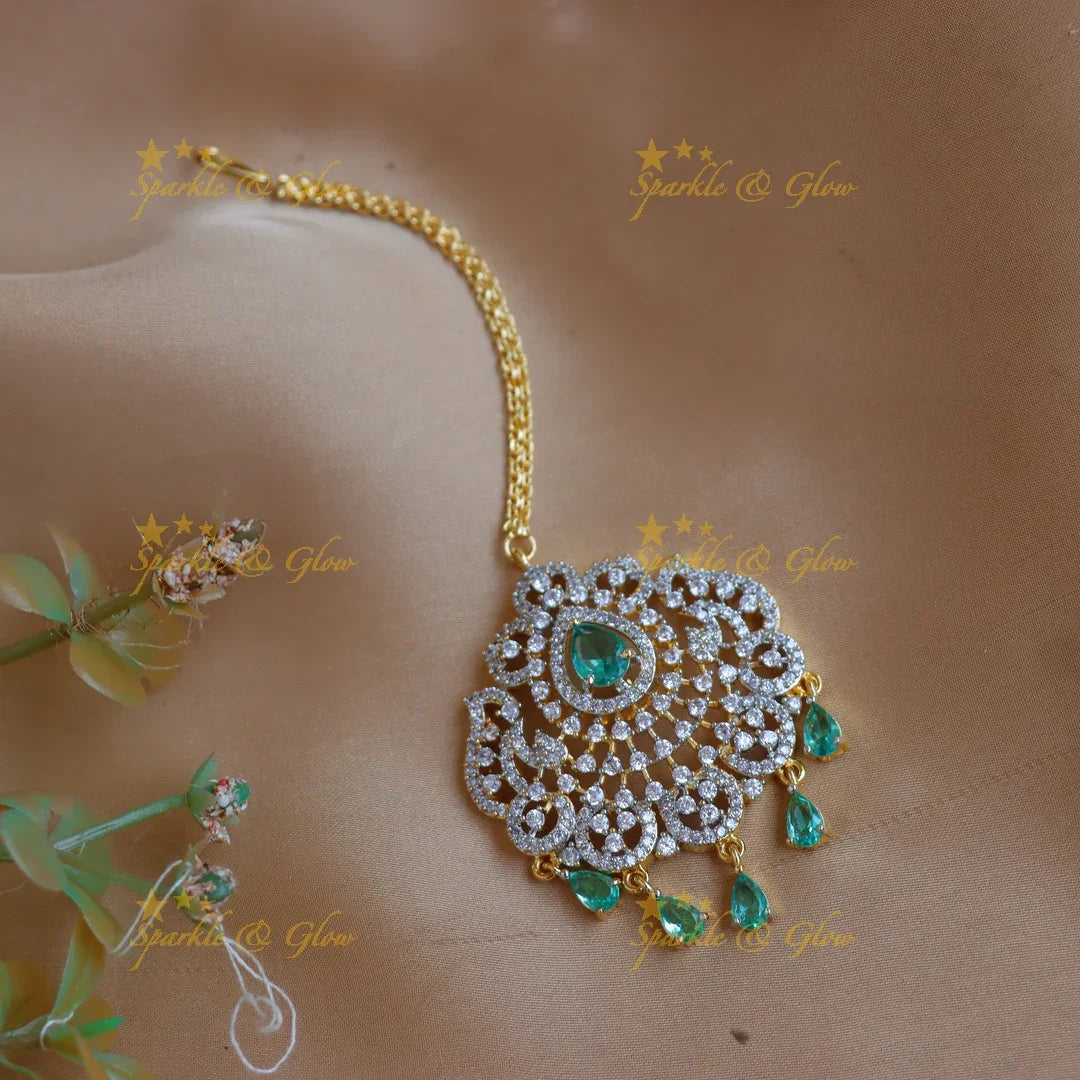 Elegant GJ polish Floral Mango carved AD Maang tikka with Teardrop Accents - Sparkle and Glow