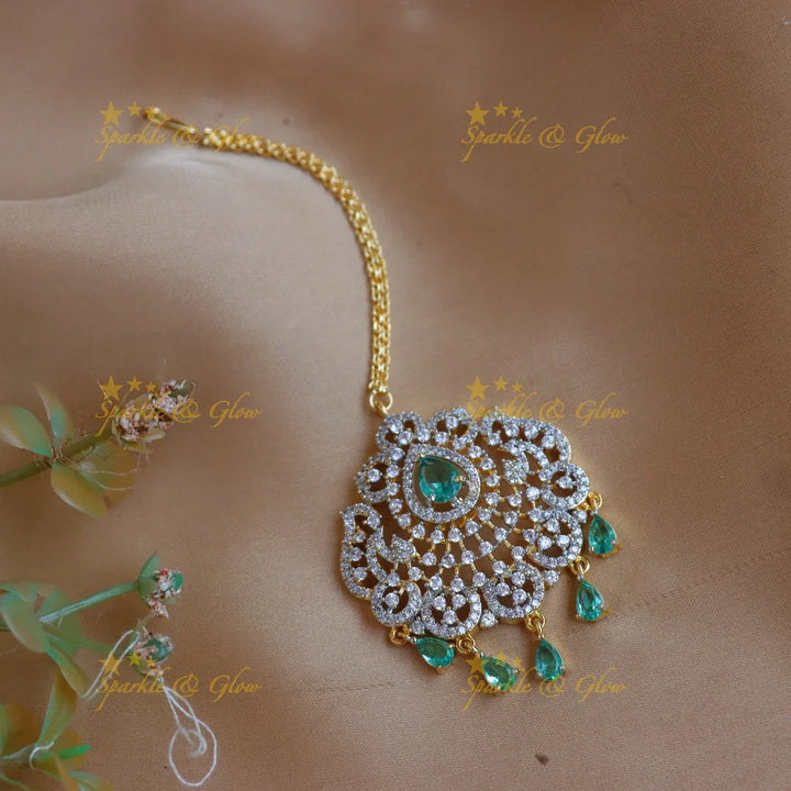 Elegant GJ polish Floral Mango carved AD Maang tikka with Teardrop Accents - Sparkle and Glow