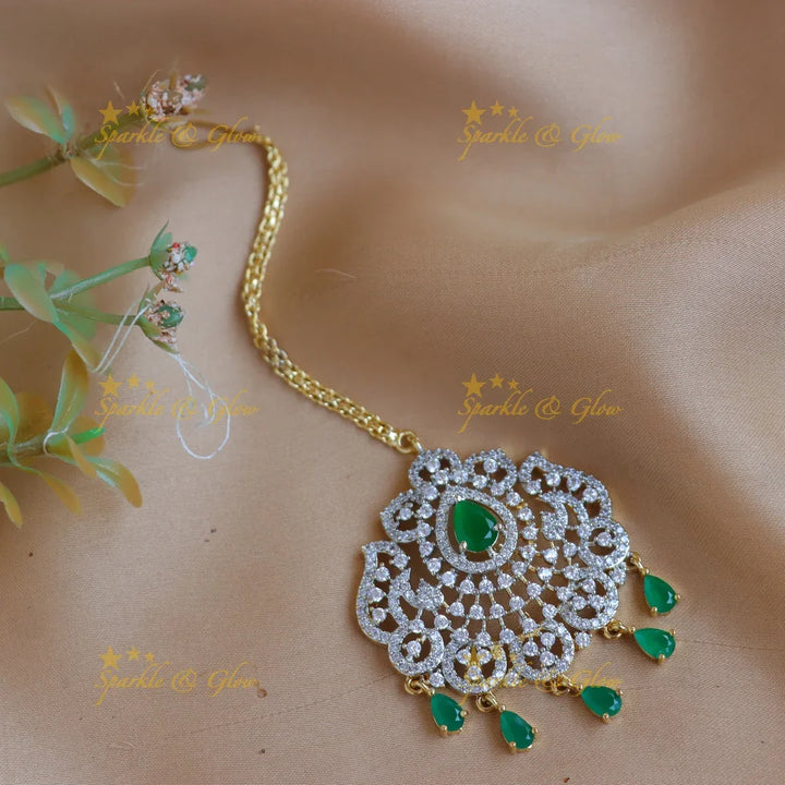 Elegant GJ polish Floral Mango carved AD Maang tikka with Teardrop Accents - Sparkle and Glow