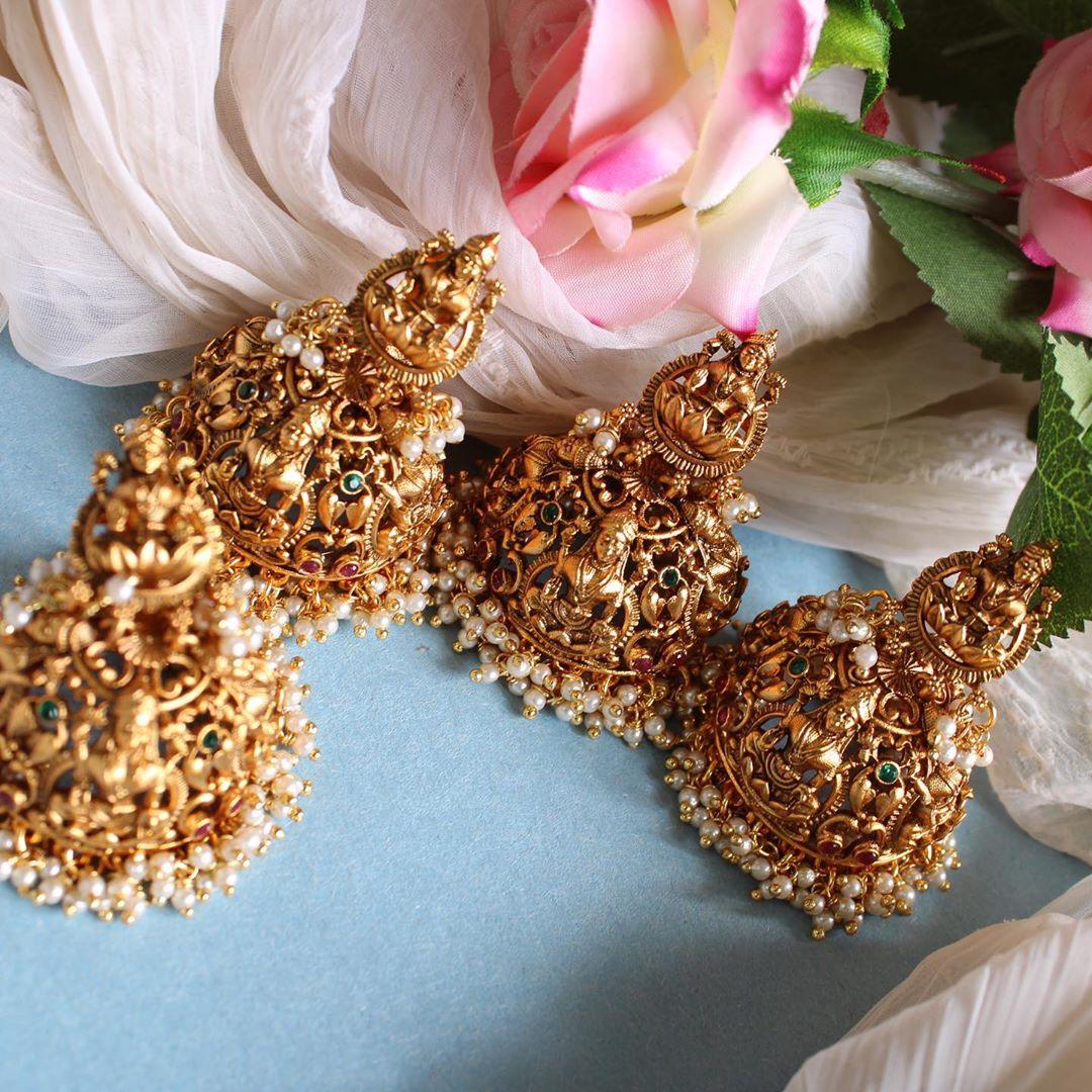 Intricately carved lakshmi jhumakas - Sparkle and Glow