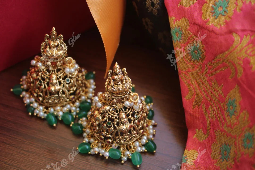 Intricately carved lakshmi jhumakas - Sparkle and Glow