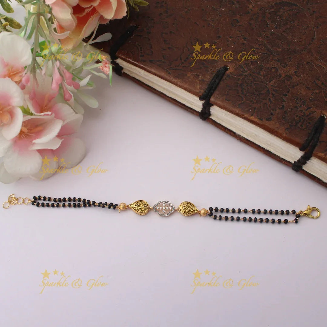 Traditional Floral design Black Bead Bracelet with Dual-Tone Charm