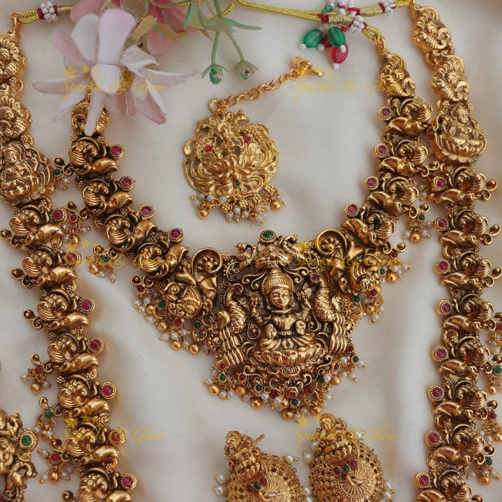 Stunning Budgeted Idol Lakshmi Peacock carved Bridal set