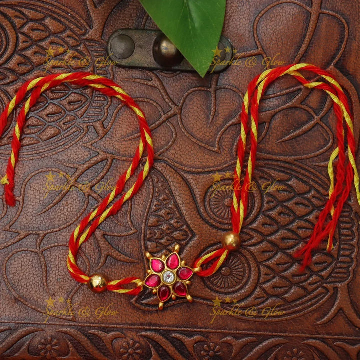 Exquisite Jadau Kundan Rakhi with Floral Motif – Sparkle & Glow