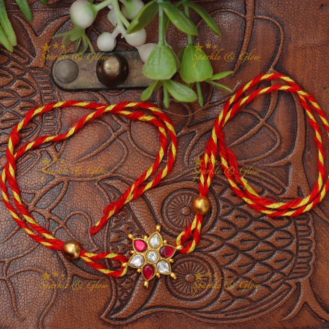 Exquisite Jadau Kundan Rakhi with Floral Motif – Sparkle & Glow