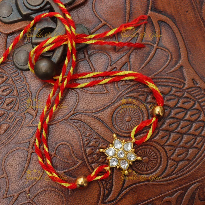 Exquisite Jadau Kundan Rakhi with Floral Motif – Sparkle & Glow