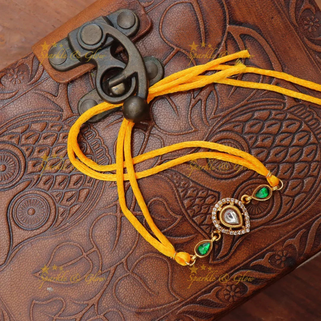 Regal Jadau Kundan Rakhi | Exquisite Green Stone Thread