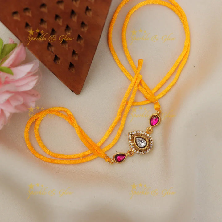 Regal Jadau Kundan Rakhi | Exquisite Green Stone Thread