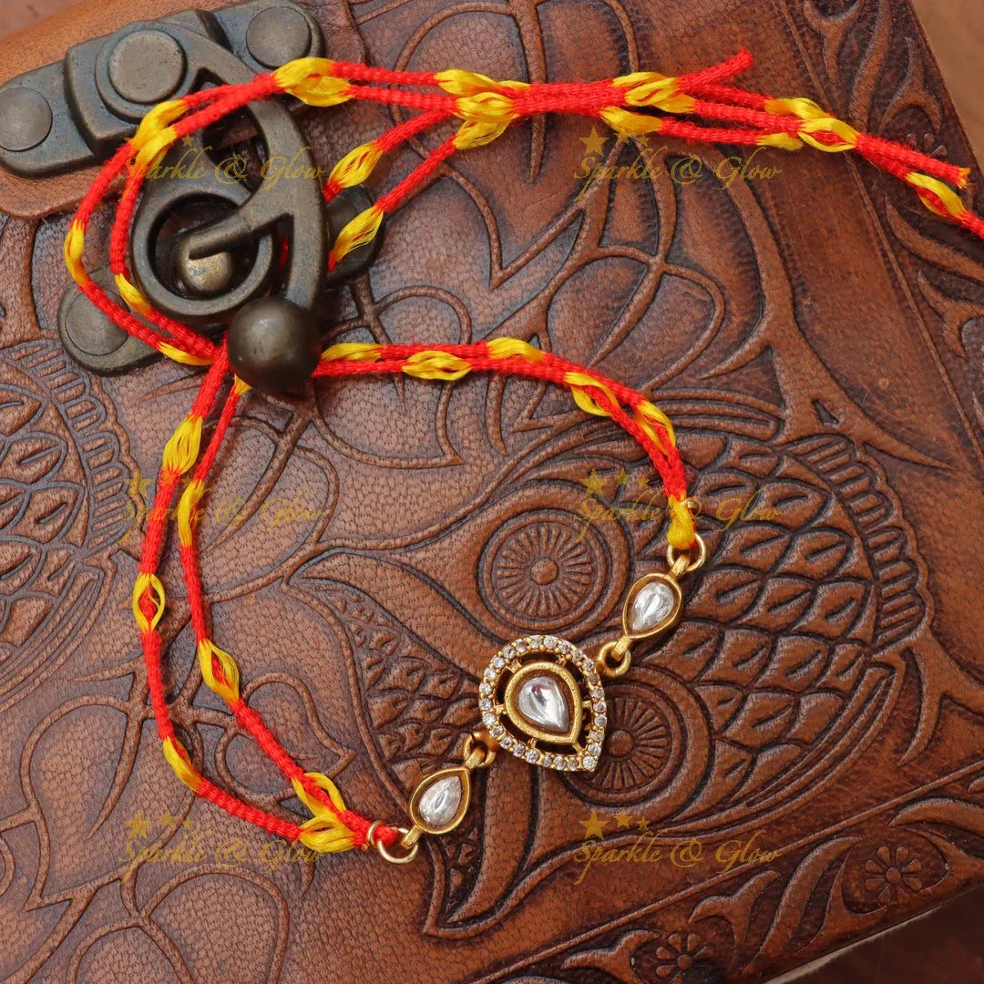 Regal Jadau Kundan Rakhi | Exquisite Green Stone Thread