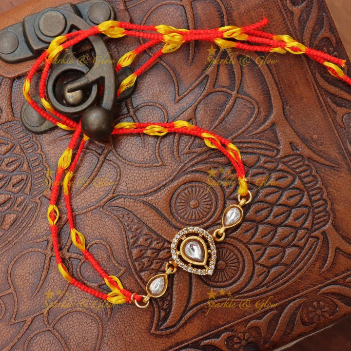 Regal Jadau Kundan Rakhi | Exquisite Green Stone Thread