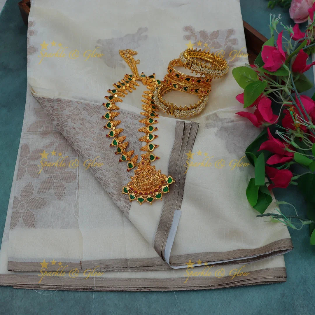 Elegant Kasavu Saree with Silver Accents & Jewellery