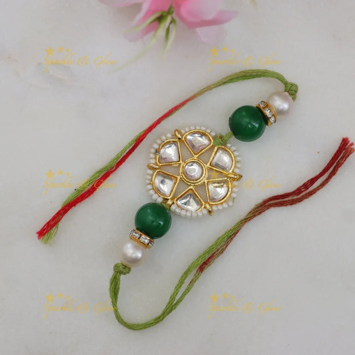 Exquisite Kundan Rakhi with Floral Design & Red Thread