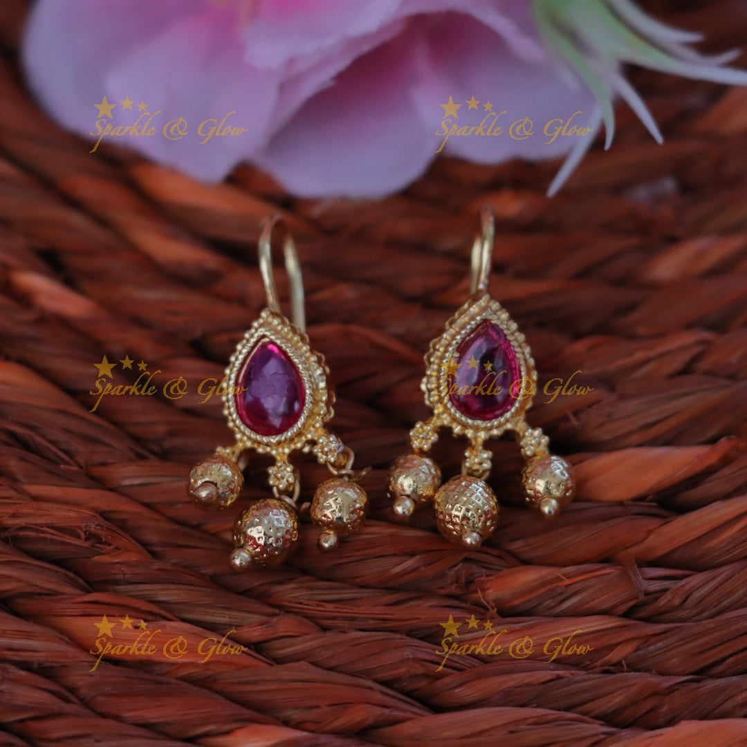 Exquisite Gold Bugadi Earrings with Red Gemstones