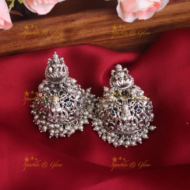 Intricately carved lakshmi jhumakas - Sparkle and Glow