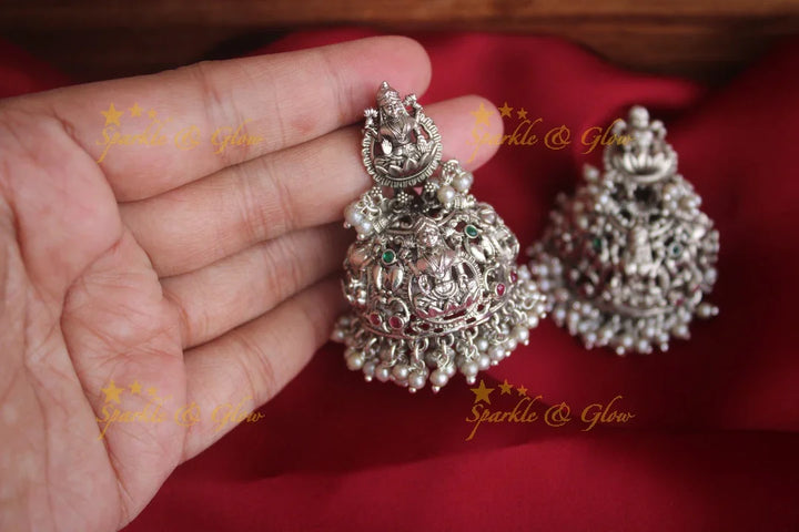 Intricately carved lakshmi jhumakas - Sparkle and Glow